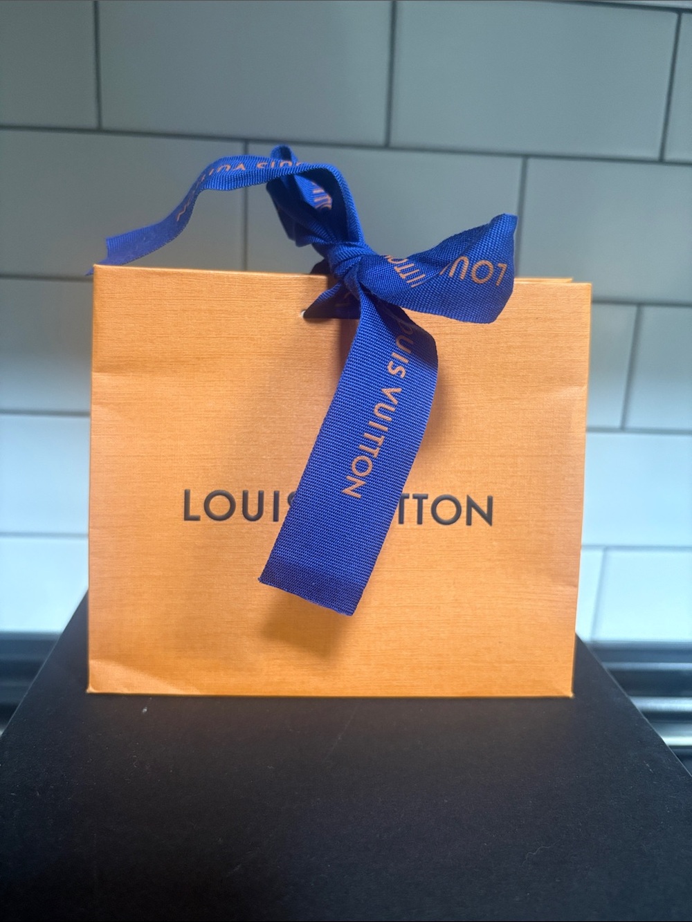 Authentic Louis Vuitton Orange Bag with Blue Ribbon Accent